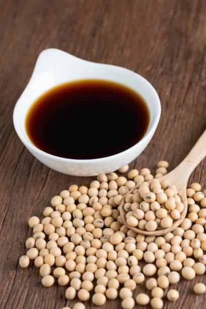 istock Soy bean with soy sauce on wood table. 689062402