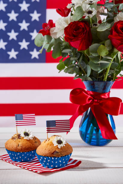 istock Beautiful bouquet with american flag and cute cupcakes 689065684