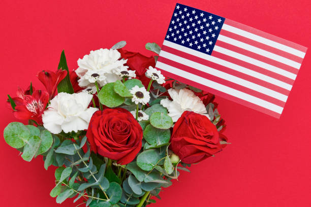 istock Beautiful bouquet with american flag on red background 689065838