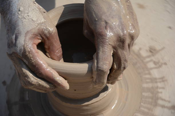 istock Making a clay pottery honey pot on the wheel 689069038
