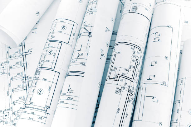 istock lots of rolls floor plan drawings on architects workspace 689069100