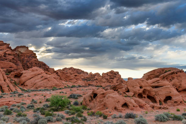 istock Dramatic Morning Clouds Over Rocky Desert Landscape 689073166
