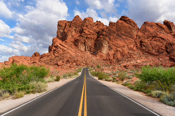 istock Desert Highway with Yellow Lines on Sunny Day 689074154