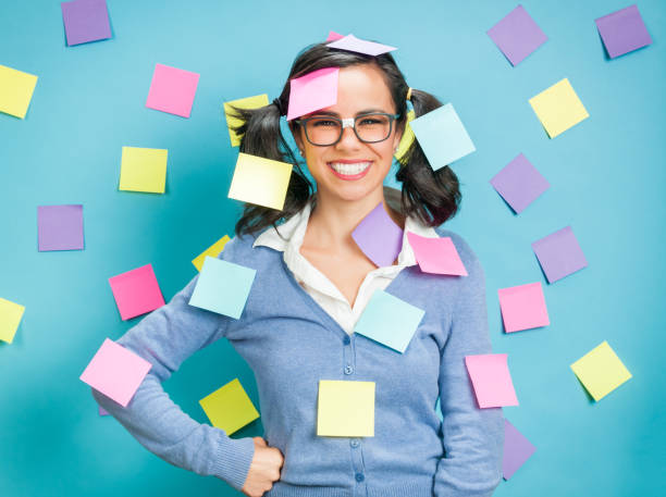 Young Hispanic Women Showing Emotional Expressions Coverd In Post-its stock photo