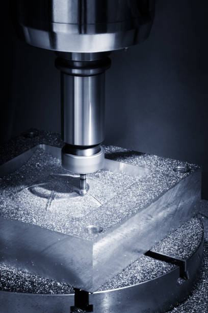 istock The Hi-precision CNC milling machine with cutting sample in blue-silver tone.The micro cutting technique in precision part. 689095002