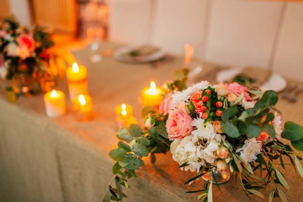 istock Flower compositions on the wedding table in rustic style. Wedding decorations with their own hands 689100308