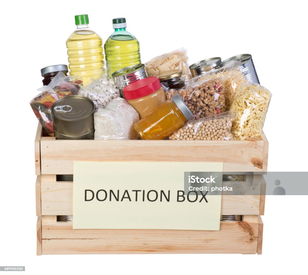 Food donations box Food donations in a wooden box isolated on white background Charitable Donation Stock Photo