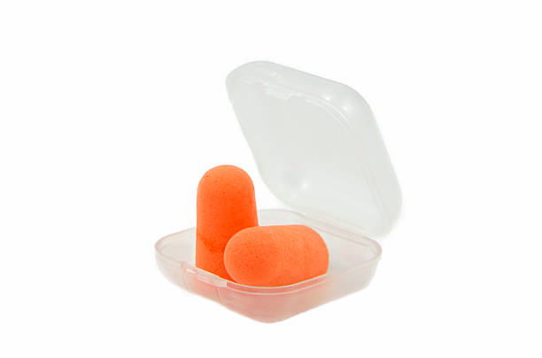 Pair of earplugs A pair of earplugs in  box isolated ear plug stock pictures, royalty-free photos & images
