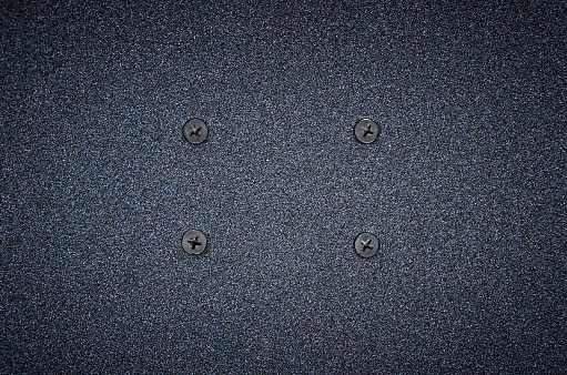 Full frame, close-up view of a worn painted metal diamond plate.