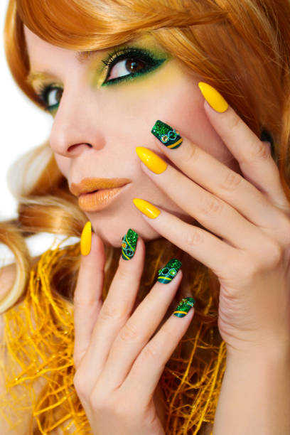 istock Green yellow makeup and manicure. 689132504
