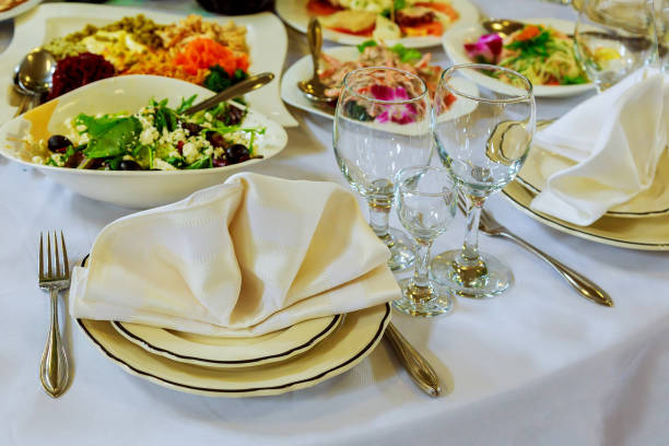 istock Empty glasses set with napkin in fine dining restaurant decorated 689134756