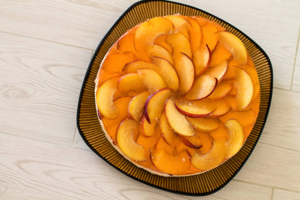 istock Fruit cake with peach, jelly and mousse. 689142430