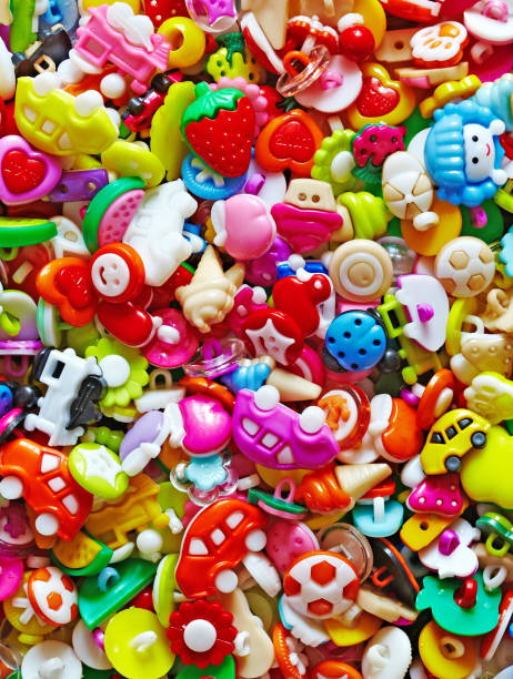 istock Cute sweet shiny colorful pattern background made from  baby buttons 689152068