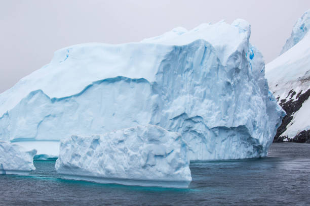 istock Antarctica: Iceberg in the Lemaire Channel 689157032