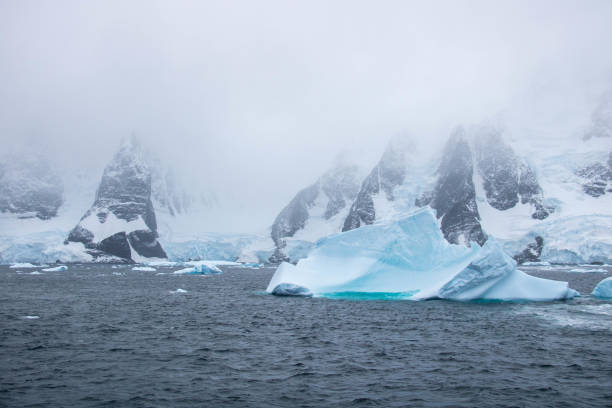 istock Antarctica: Iceberg in the Lemaire Channel 689165896