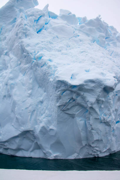 istock Antarctica: Iceberg in the Lemaire Channel 689165978