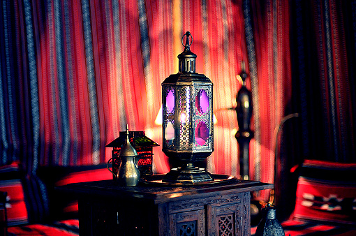 Dubai, United Arab Emirates - January 1, 2023: Collections of old lanterns displayed as art at famous Al Fahidi historical neighborhood (Al Bastakiya) located in old Dubai also known as Bur Dubai. Al Fahidi Historical Neighborhood next to Dubai Creek, visited by locals and tourists alike giving visitor closer look to past century tradition values and culture.