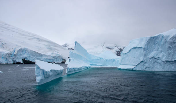 istock Antarctica: Iceberg in the Lemaire Channel 689166252