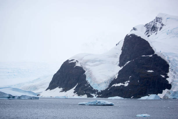 istock Antarctica: Iceberg in the Lemaire Channel 689172374