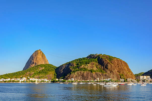 Sugar Loaf hill Sugar Loaf hill and Guanabara bay in Rio de Janeiro sugarloaf mountain stock pictures, royalty-free photos & images