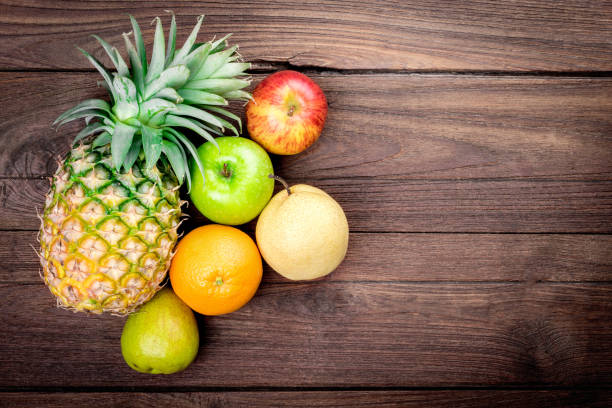 istock fruits on background wooden 689179778