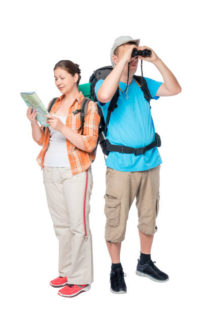 istock travelers with a map and binoculars on a white background with backpacks 689182642