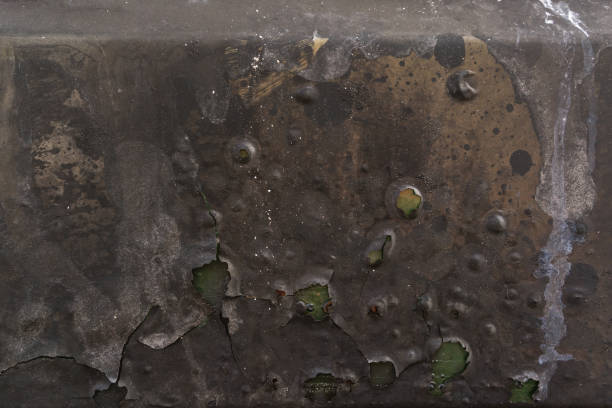istock burnt corrugated lacquer colors on rusty metal surface, green underground 689182738