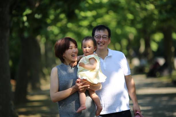 istock Happy family at spring park 689190804