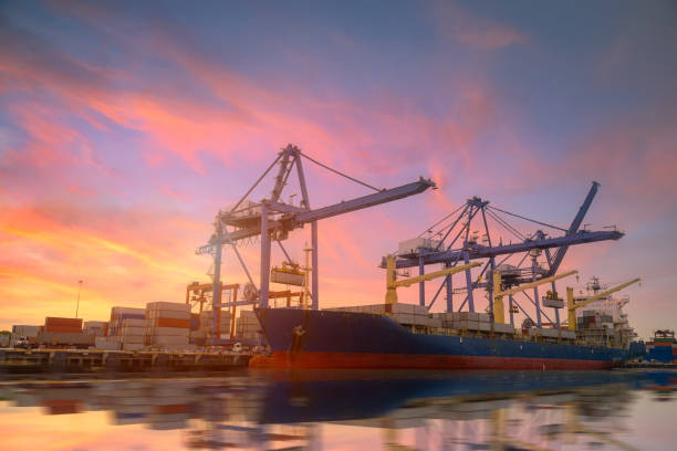 istock Logistics and transportation of Container Cargo ship and Cargo plane with working crane bridge in shipyard at Twilight sky, logistic import export background and transport industry. 689193814