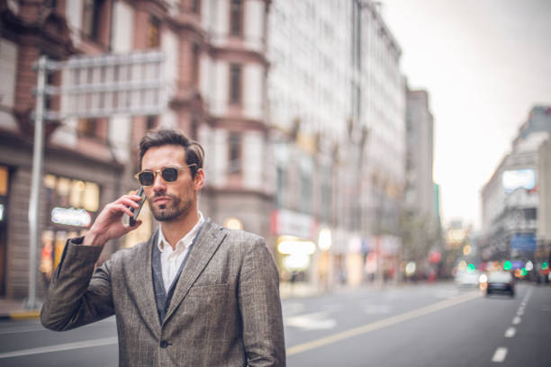 istock Handsome man talking on the phone 689197478