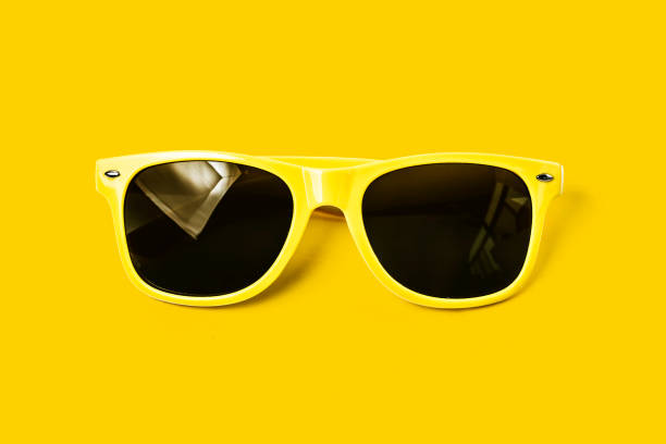 istock Yellow glasses on a yellow background, sunglasses 689202244