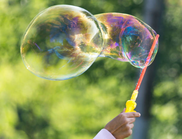 istock Beautiful soap bubbles fly in the city 689205888
