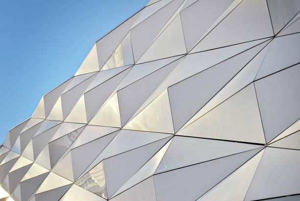 istock Polygonal triangle glass facade of modern building. 689234360