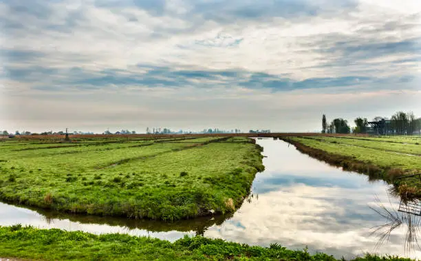 Photo of Low Polder Canals Wooden Windmill Zaanse Schans Village Holland Netherlands