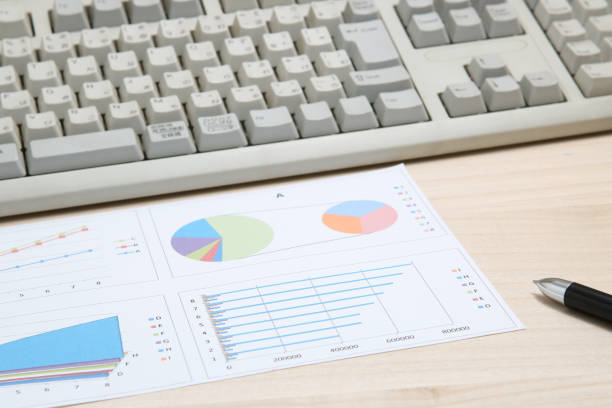 istock Business concept. Charts, diagrams, tables with computer keyboard. 689235546