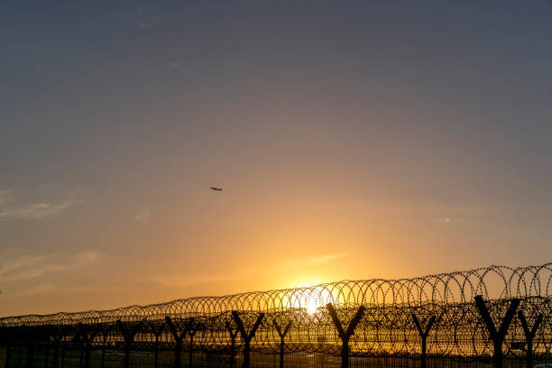 istock barbed wire around airport 689238094
