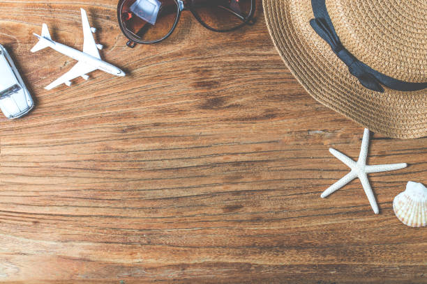 istock Straw hat and sunglasses on wood 689238354