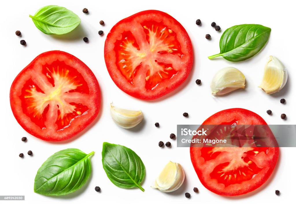 tomato, garlic and basil tomato, garlic and basil isolated on white background, top view Tomato Stock Photo