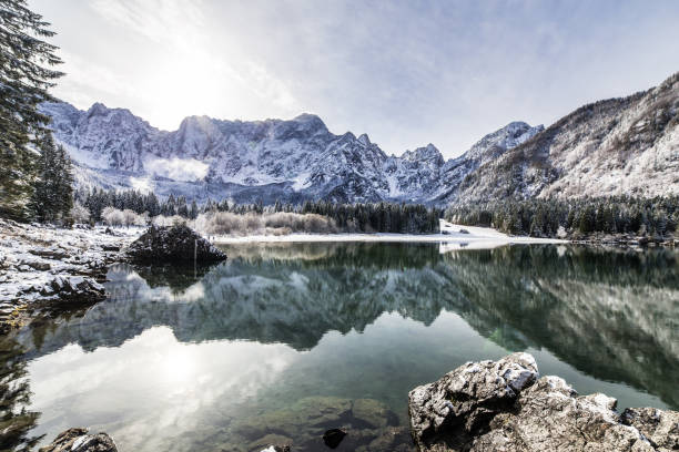 istock first snow at the mountain lake 689246600