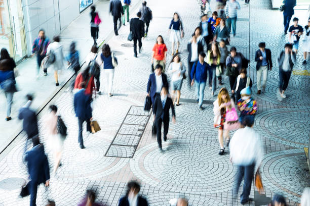istock crowde people on street in modern city 689249122
