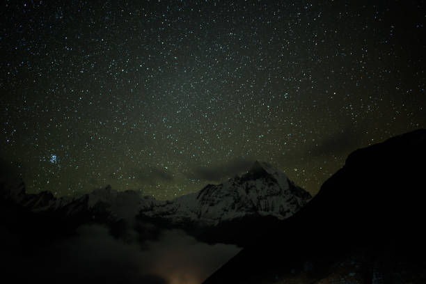 istock Mt.Machapuchare in the night with gain and soft focus 689252374