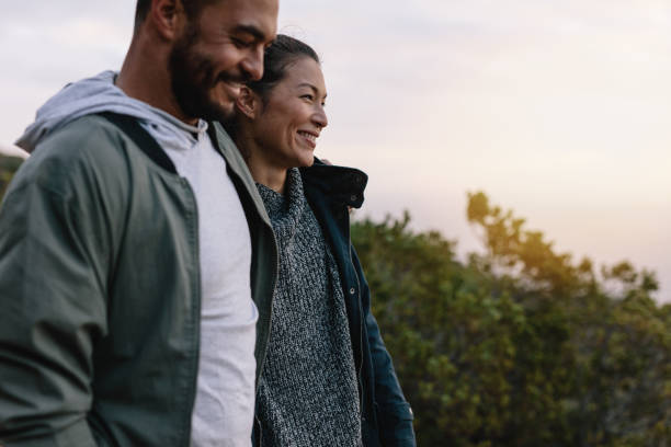 istock Smiling couple hiking in countryside 689256604