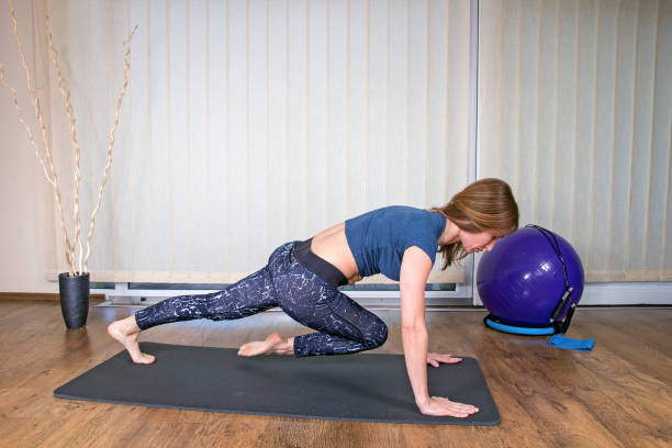 istock Beautiful Woman Doing Core Exercise on Fitness Mat 689256916