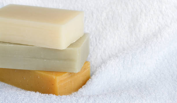 istock Natural homemade soaps on white bath towel background. 689262910