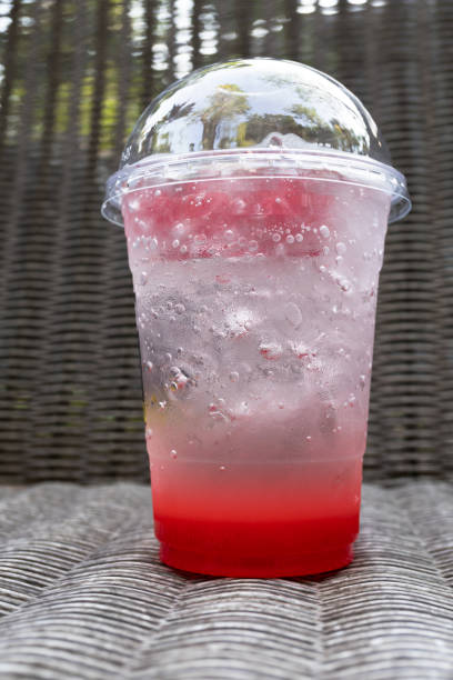 istock strawberry italian soda with ice on wickerwork table 689263626