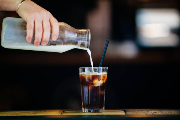 istock Pouring cream in cold brew coffee 689270952