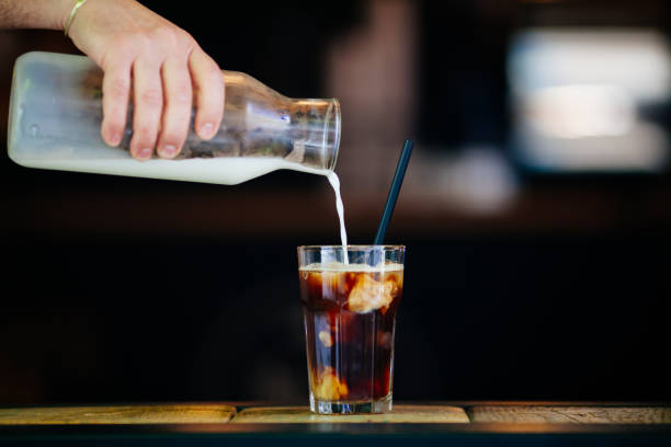 istock Pouring cream in cold brew coffee 689271092