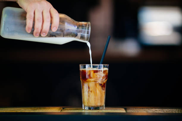 istock Pouring cream in cold brew coffee 689271110