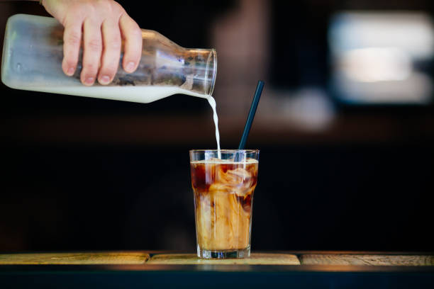 istock Pouring cream in cold brew coffee 689271130