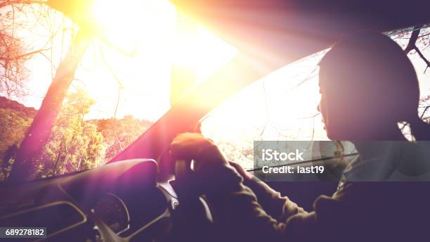 Sun During The Day Time Driving On The Road At Speed Women Driving Car Stock Photo - Download Image Now